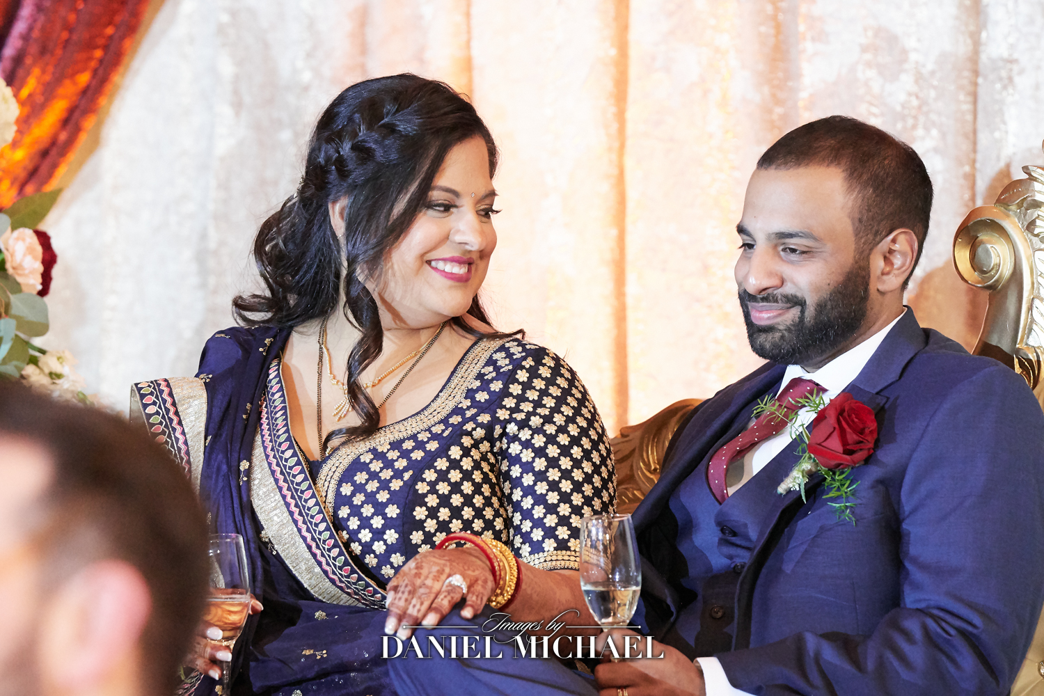 South Asian wedding photographer capturing candid moments at a wedding reception